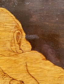 High-contrast burned background and smooth wood texture detail.