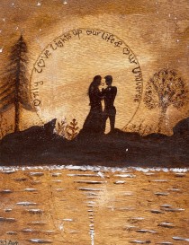 Detailed wood burning of couple silhouette and romantic quote.