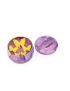 Open handmade butterfly candle tin next to its decorative purple marble lid.