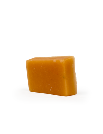 Side view of a rectangular, amber-colored antibacterial glycerin soap bar.