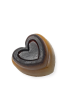 Side view of heart-shaped lavender glycerin soap showing translucent layers and botanicals.