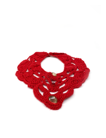Flat lay of a dark red handmade crochet statement collar with decorative beads on a white background.