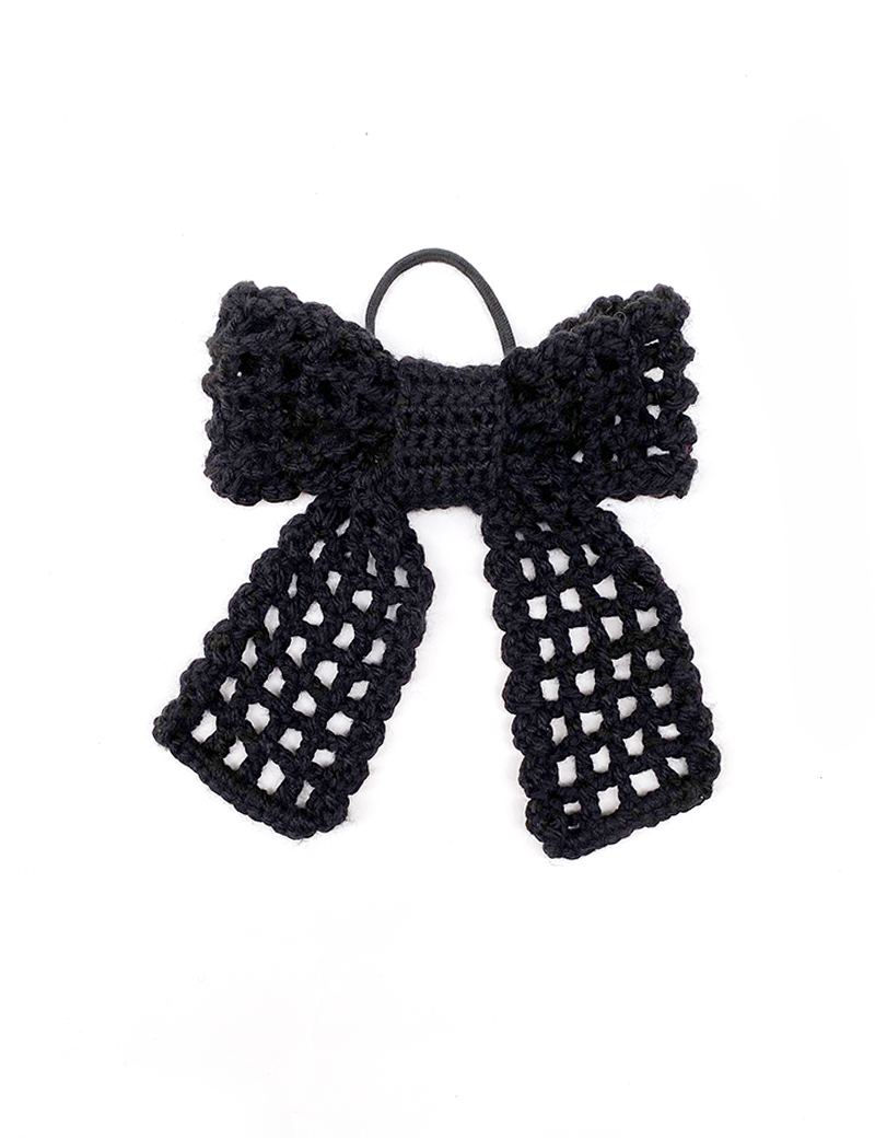 Top-down view of a black crochet ribbon bow hair tie with mesh pattern.