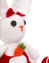 Profile view of white amigurumi rabbit showing button eyes and orange nose.