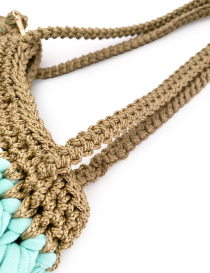 Detailed view of the sturdy braided champagne-colored shoulder straps.