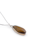 Thick Tiger’s Eye gemstone in silver bezel setting.