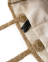 Detailed view of the cream cotton lining, internal pockets, and gold magnetic snap closure.