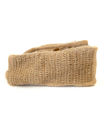 Side profile showing the depth of the bag and the texture of the crochet weave.