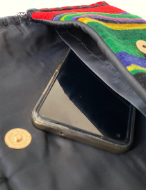 Phone inside the divided interior compartment of the wool bag.