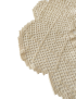 Close-up of scalloped edges on beige crochet cover