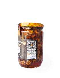 Side view of 900g honey jar showing walnut density and QR code.