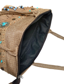 Open view of the interior black lining and zippered security pocket.