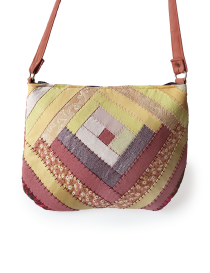 Detailed stitching on brown geometric quilted purse.