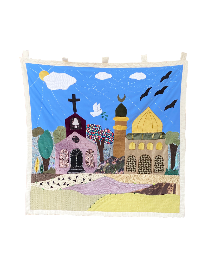 Full view of hand-embroidered Syrian unity wall hanging with church and mosque.