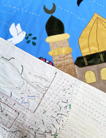 Close-up of raw linen backing and hand-stitching detail on fabric tapestry.