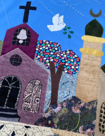 Detail of embroidered church and mosque symbols on Syrian fabric panel.