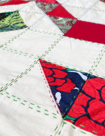 Perspective view of geometric layout and hand-sewn textile seams.