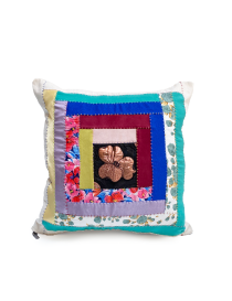 Filled 50X50 cm patchwork cushion standing upright.