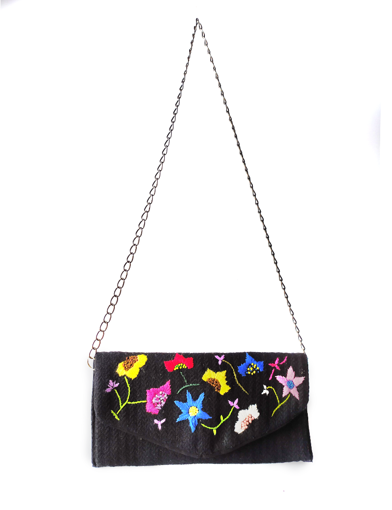 Fazlakat black flap bag with colorful floral embroidery and chain strap.