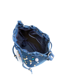 Interior view showing navy lining and pockets of denim bucket bag.