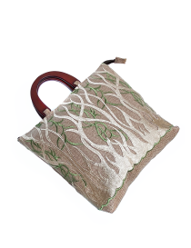 Angled view of the embroidered tote showing fabric texture.