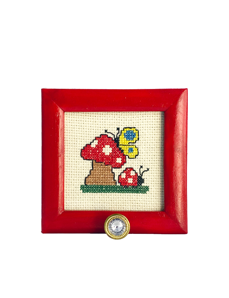 Red mushroom cross-stitch in red frame with crystal wall hook.