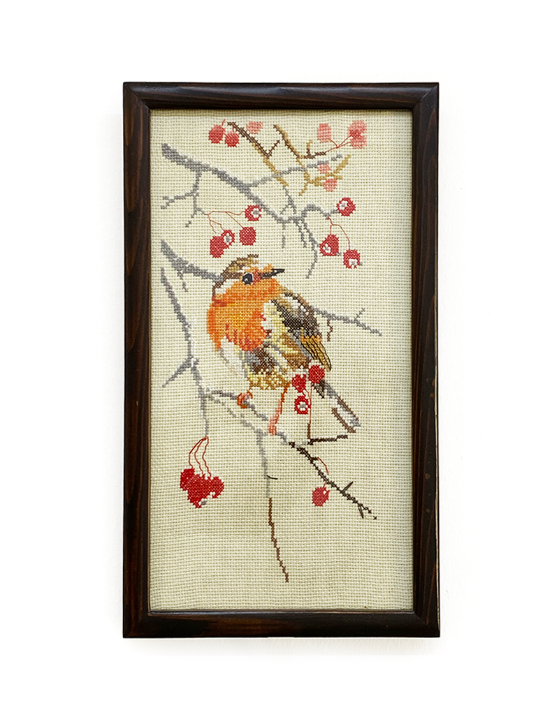 Framed robin and berries cross-stitch wall art full view.