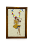 Framed handmade cross-stitch of girl on flower swing wall art.