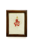 Front view of a framed red candle cross-stitch art with a dark wood frame.