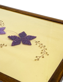 Side angle showing the depth of the wooden frame and bead craftsmanship.