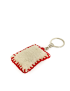 Rear perspective of padded hand-embroidered keychain showing durable red crochet edge stitching.