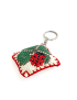 Close-up of the detailed needlework on the padded ladybug clover keychain.