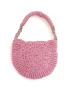 Reverse side of pink crochet purse showing circular woven pattern.