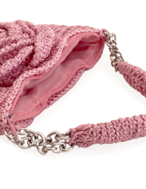 Interior view of pink crochet bag showing zipper closure and lining.