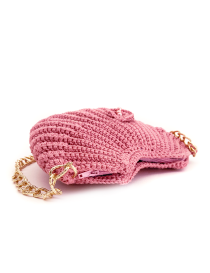 Side view of blush crochet bag showing pink zipper closure.