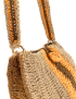 Close-up of gold-tone metal rings and the sturdy crochet strap of the shoulder bag.