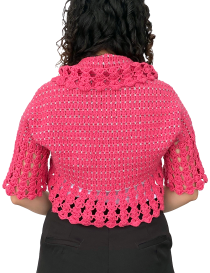 Rear view of pink handmade crochet shrug showing detailed stitch pattern.