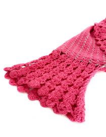 Detailed close-up of pink and silver openwork crochet knit texture.