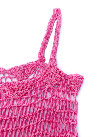 Detailed view of the durable handmade crochet straps on pink dress.