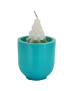 Handmade Christmas tree scented candle in a teal ceramic pot for delivery in Syria.