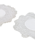 Top-down view of two vintage-style white needle-work coasters for coffee service.