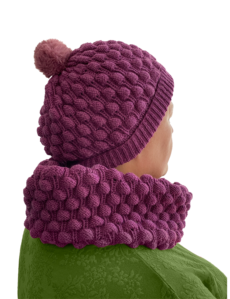 Woman wearing purple knit hat and infinity scarf set in Syria