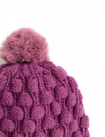 Purple knit beanie hat with soft pink faux fur pompom