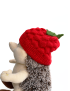 Side view of textured red strawberry baby hat for Syria gift