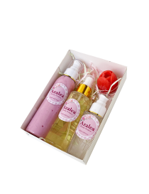 Overhead view of Azalea beauty hamper featuring hyaluronic acid serum and fragrance set.