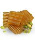 Crunchy golden pumpkin jam slices with green pistachios.