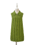 Girls' handmade green sleeveless knitted dress with textured skirt and swan brooch.
