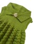 Girls' handmade green sleeveless knitted dress with textured skirt and swan brooch.