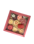 Crimson red wooden gift box with sliding glass lid containing floral-shaped wax candles.