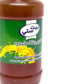 Bottle of Beit Sitti Natural Orange Juice with green cap and label.